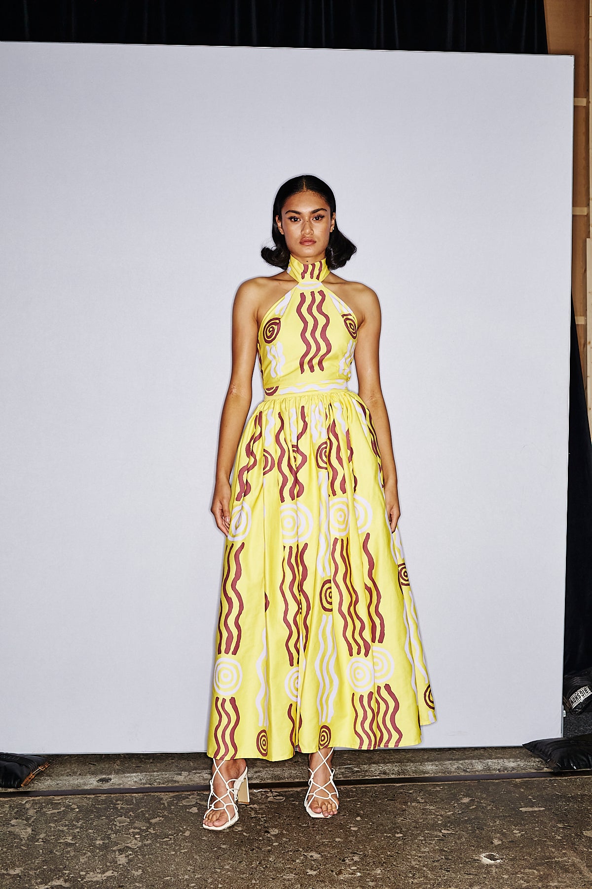 Lemon halter neck dress with a bubble skirt Wirliyajarrayi Story by Roseanna Larry OSSOM x Ikuntji Artists AAFW 23