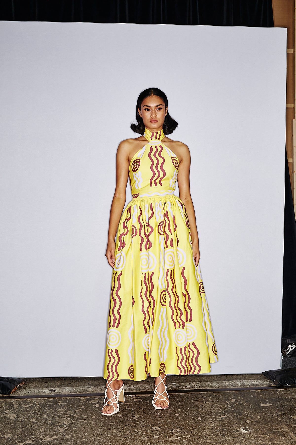 Lemon halter neck dress with a bubble skirt ‘Wirliyajarrayi Story' by Roseanna Larry OSSOM x Ikuntji Artists AAFW '23