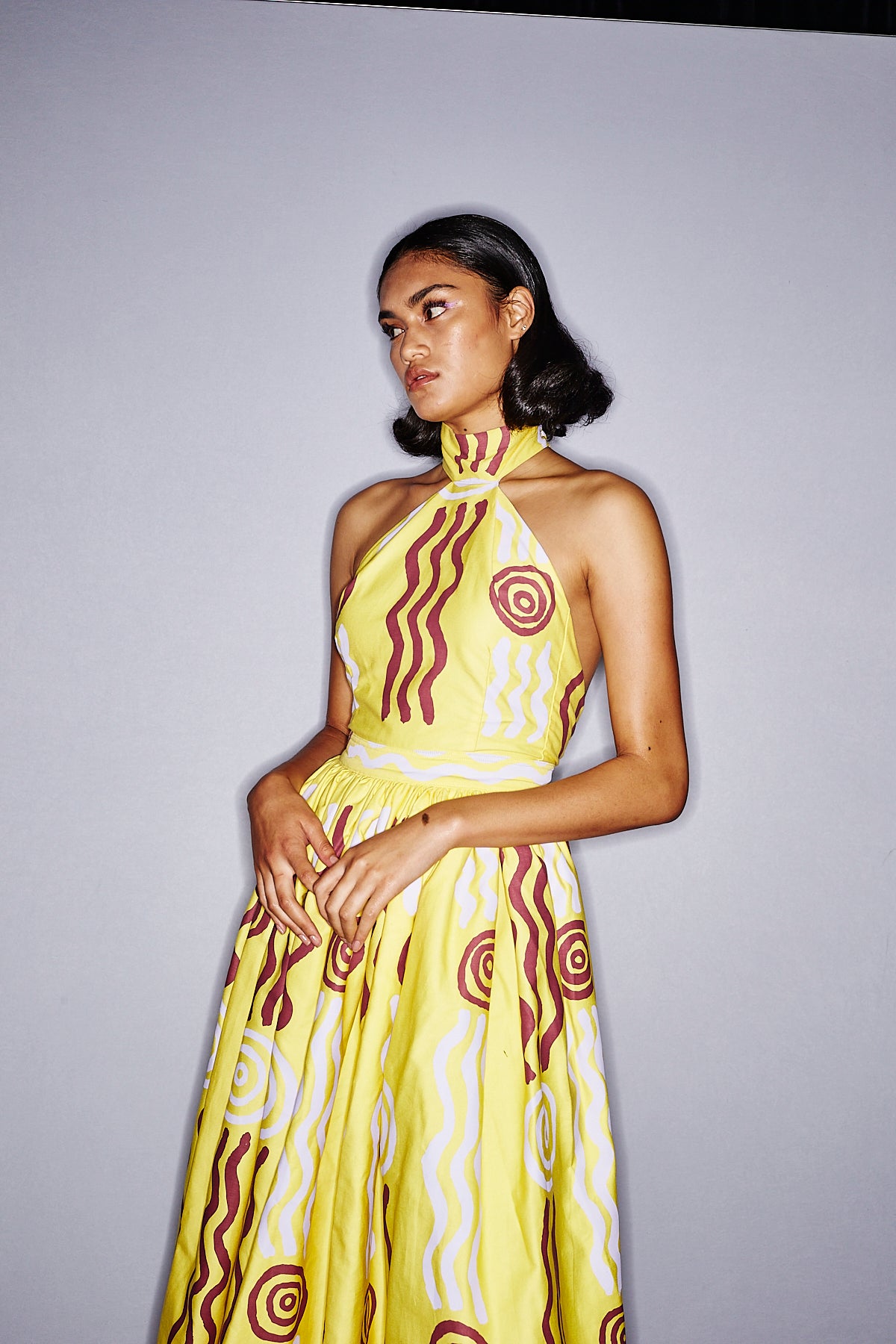 Lemon halter neck dress with a bubble skirt ‘Wirliyajarrayi Story' by Roseanna Larry OSSOM x Ikuntji Artists AAFW '23